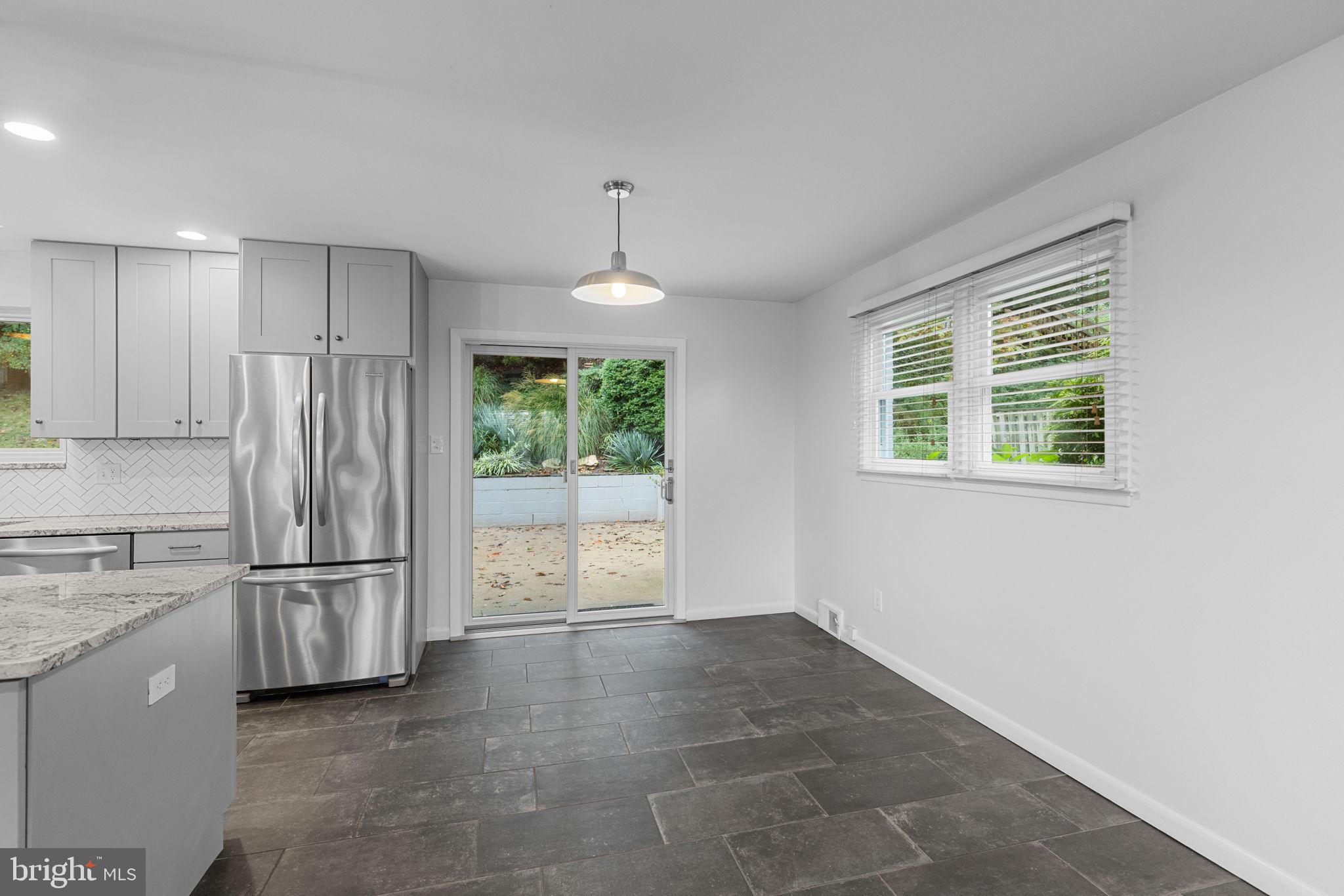 5920 Atteentee Road Springfield, VA 22150 - Photo 12 of 33 a view of kitchen with stainless steel appliances granite countertop a refrigerator and a sink