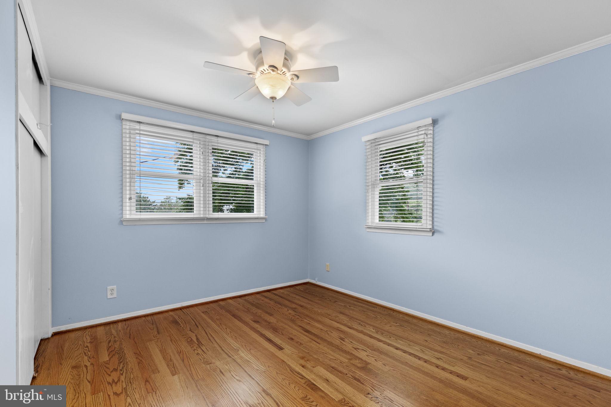 5920 Atteentee Road Springfield, VA 22150 - Photo 18 of 33 a view of a room with wooden floor and chandelier