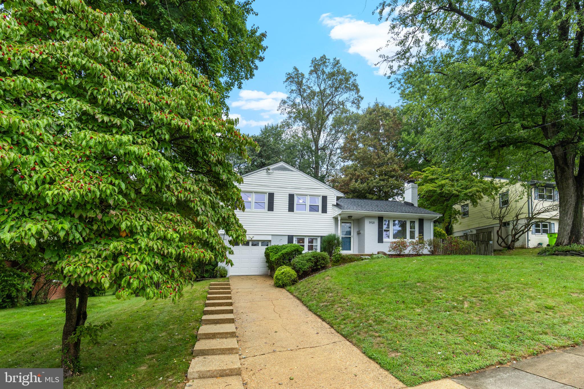 5920 Atteentee Road Springfield, VA 22150 - Photo 2 of 33 a front view of a house with a garden