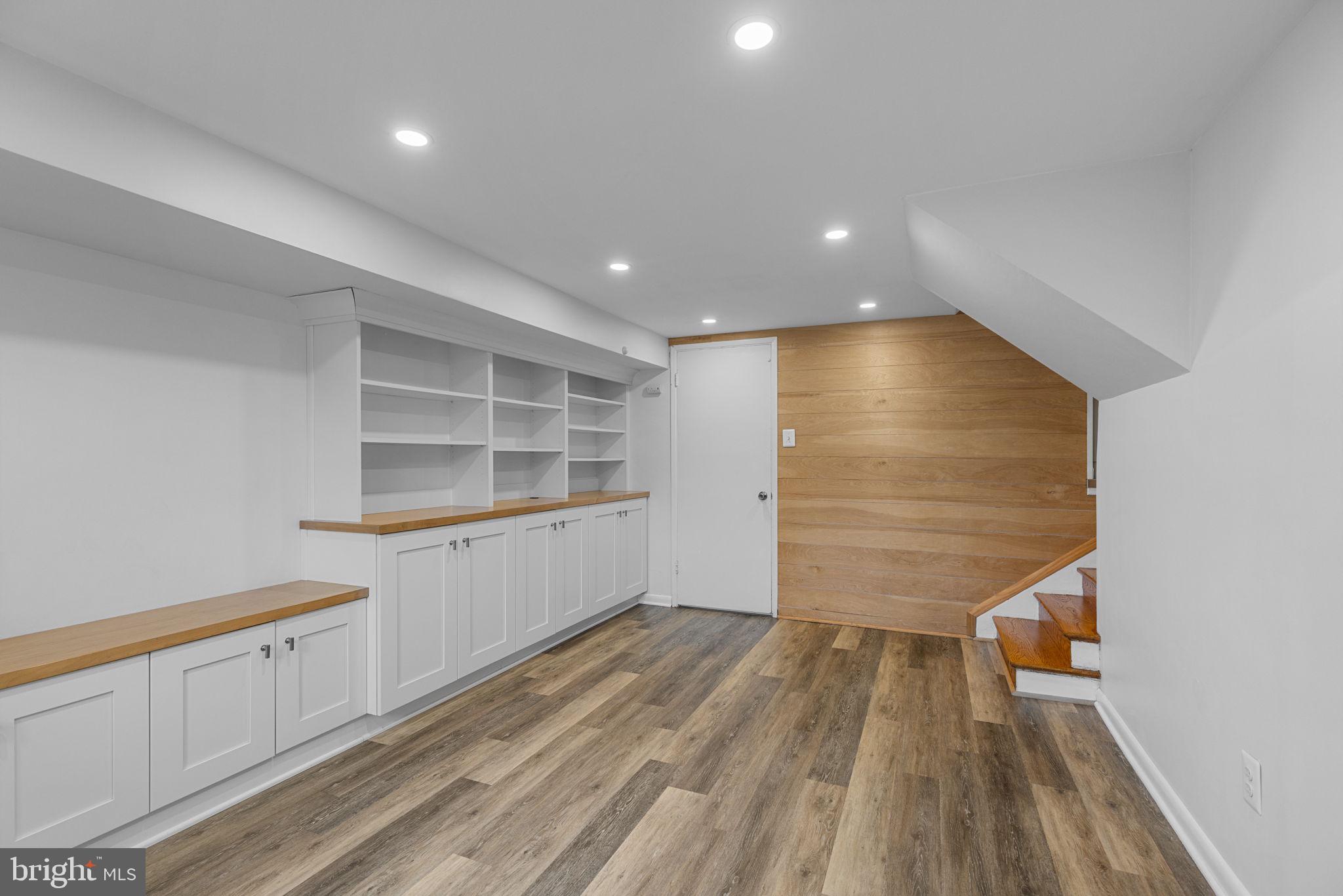 5920 Atteentee Road Springfield, VA 22150 - Photo 24 of 33 a view of an empty room with wooden floor and a window