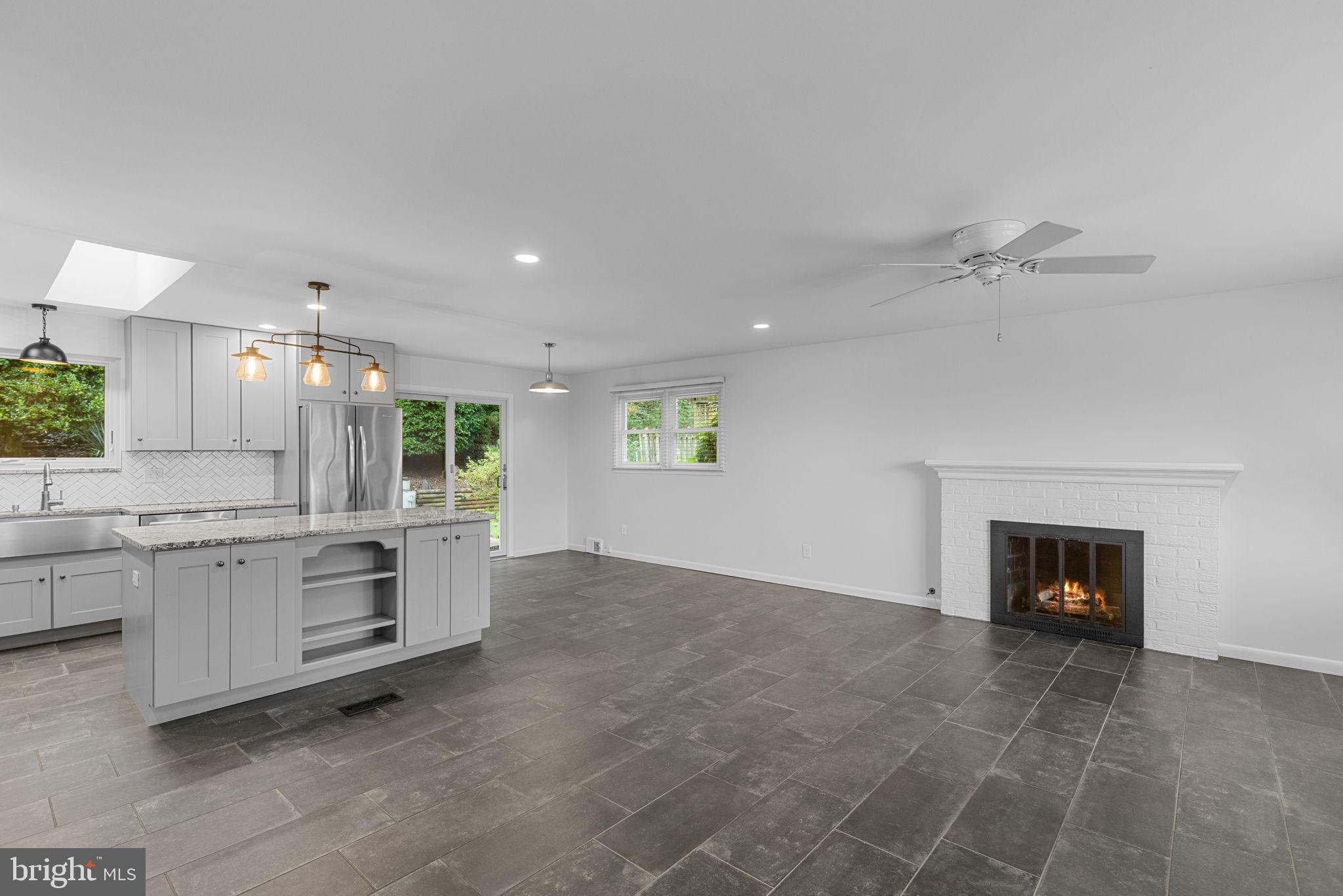 5920 Atteentee Road Springfield, VA 22150 - Photo 7 of 33 a view of kitchen with sink and a fireplace