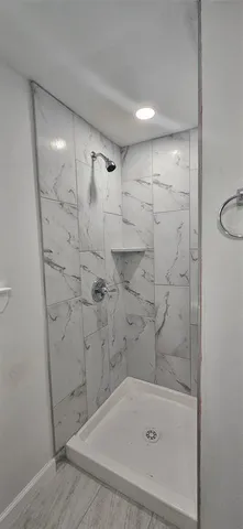 a bathroom with a shower and a bathtub