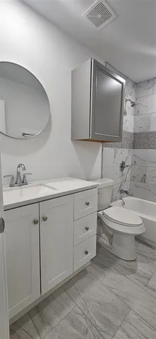 a spacious bathroom with a double vanity sink mirror and double