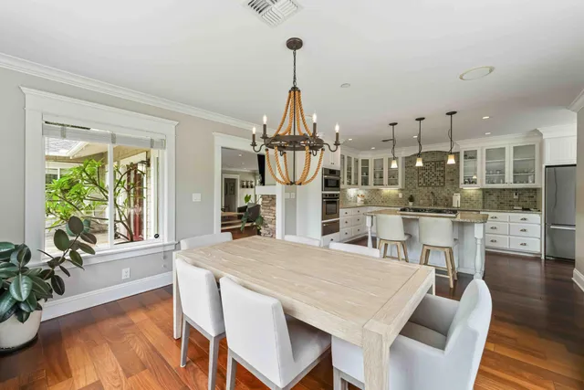 a bed room with a bed and a large window