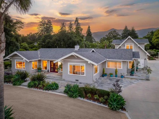 a view of a garden with a building in the background