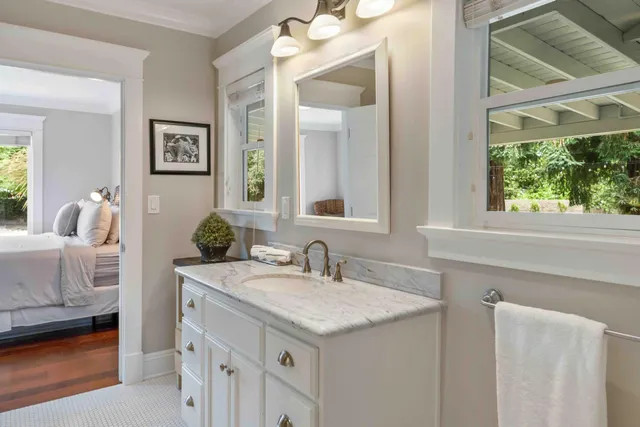 a view of backyard of house with green space