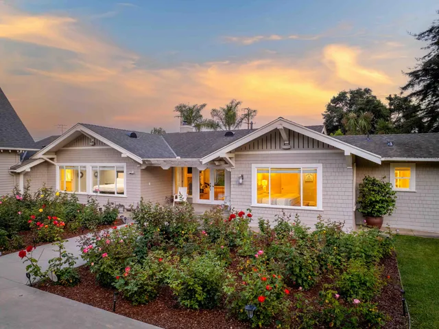 a living room with furniture and windows