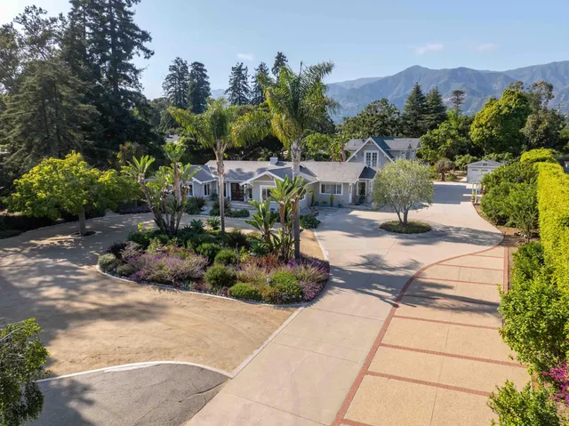 a bathroom with a toilet sink a shower and a mirror