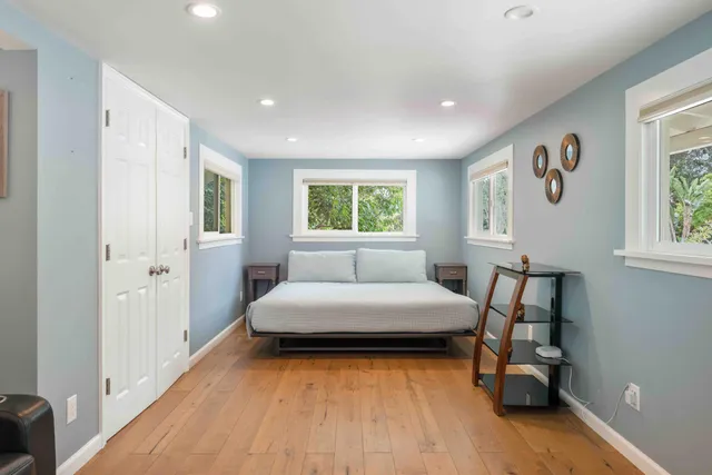 a front view of a house with a garden