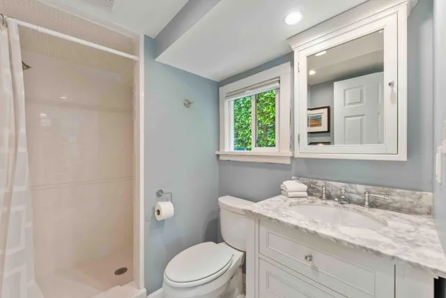 a view of a house with a big yard and potted plants