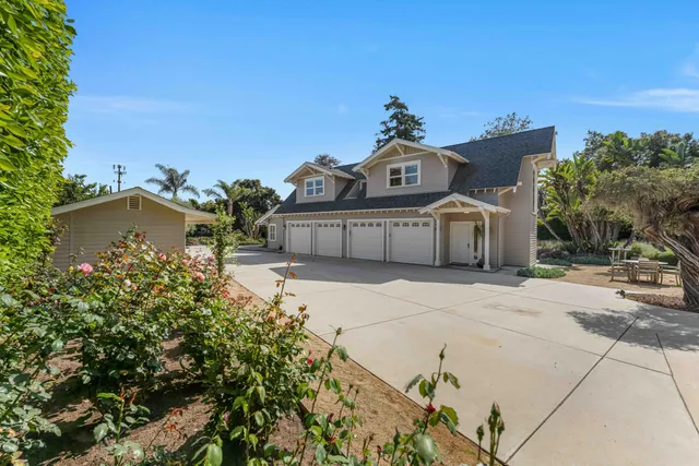 a view of a patio with table and chairs and potted plants
