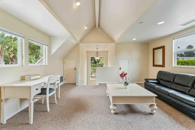 a backyard of a house with a yard with outdoor seating