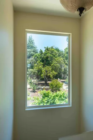 a picture of a bench in front of a wall