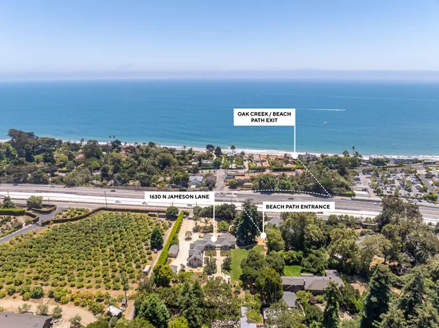 a living room with fireplace furniture and a wooden floor
