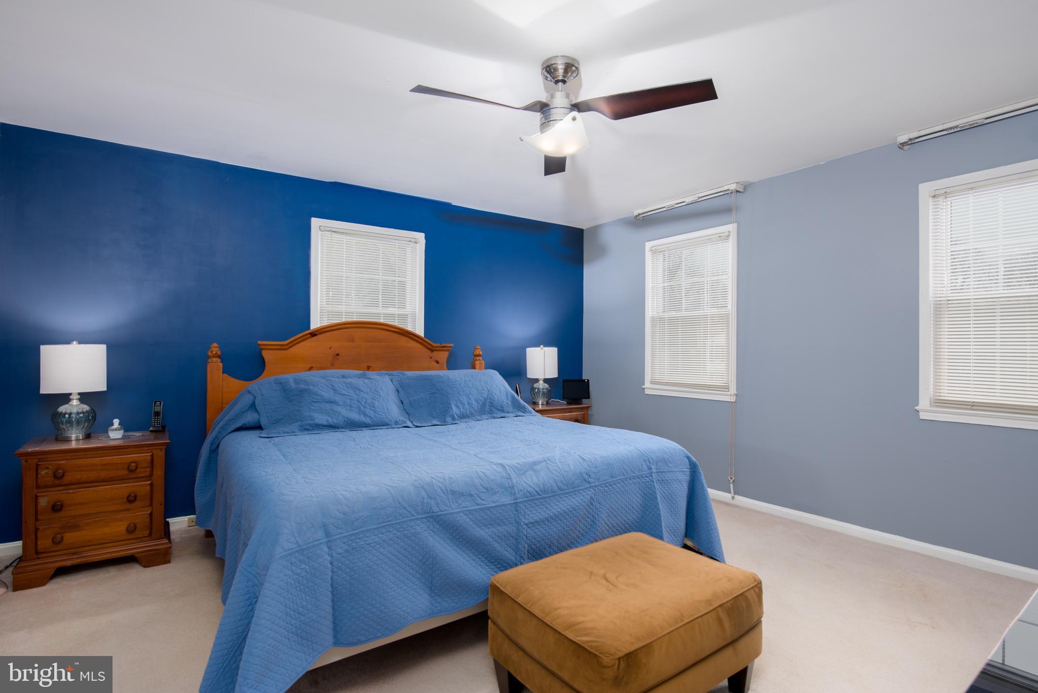 14211 Ansted Road Silver Spring, MD 20905 - Photo 14 of 27 a bedroom with a bed and window