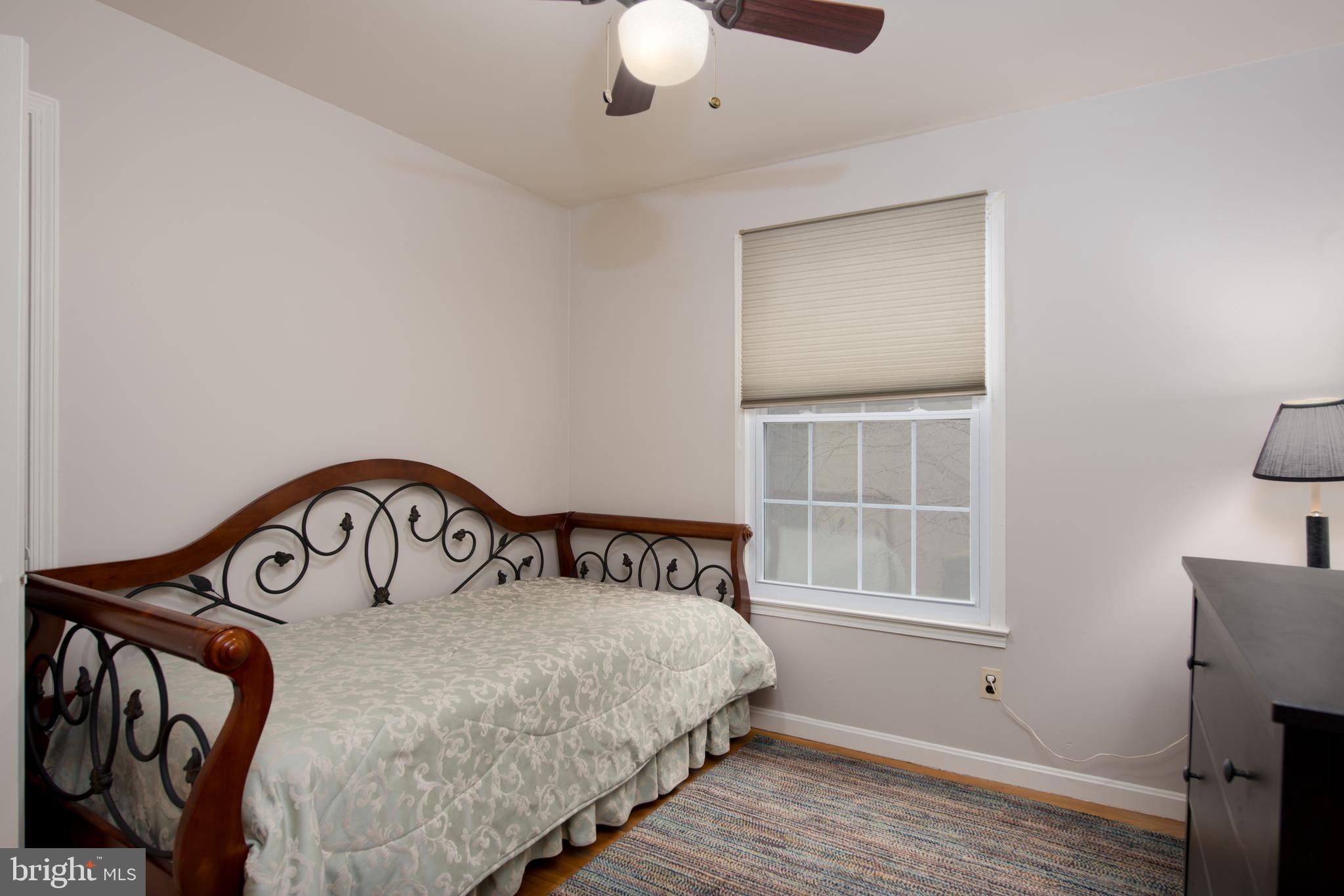 14211 Ansted Road Silver Spring, MD 20905 - Photo 20 of 27 a bedroom with a bed and a window