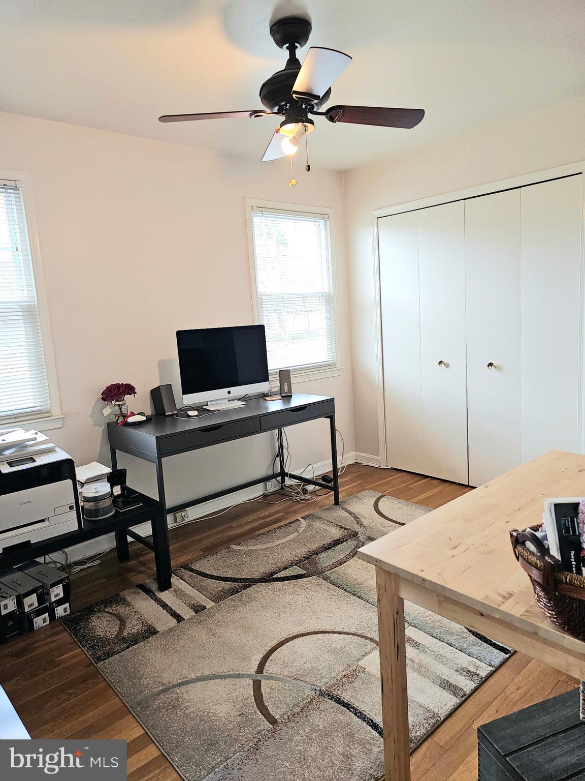 14211 Ansted Road Silver Spring, MD 20905 - Photo 21 of 27 a bedroom with a bed and a chandelier