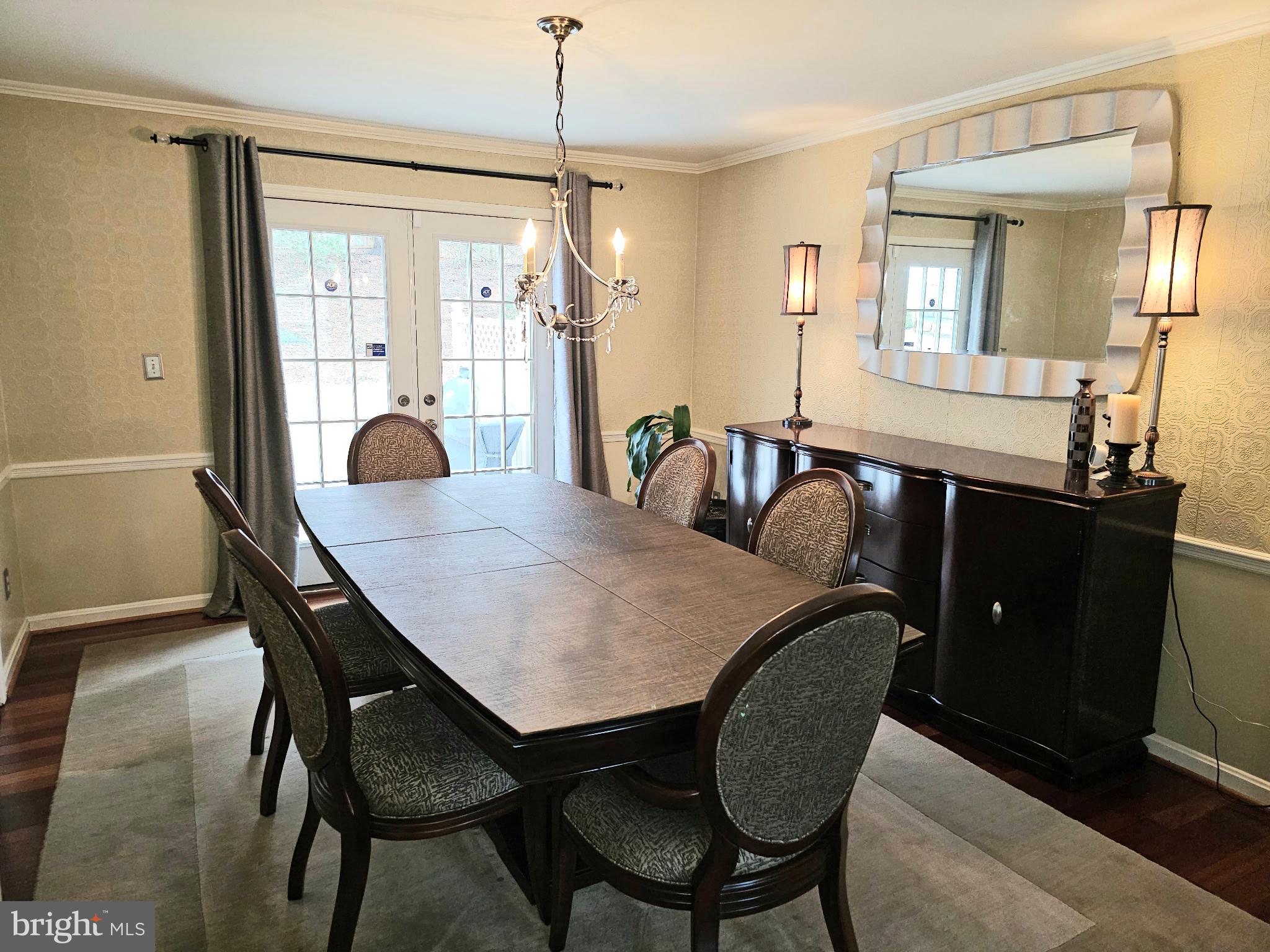 14211 Ansted Road Silver Spring, MD 20905 - Photo 7 of 27 a view of a dining room and livingroom with furniture