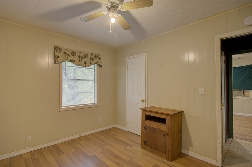 92 No-Where Road Blairsville, GA 30512 - Photo 19 of 36 a view of an empty room with a window and wooden floor