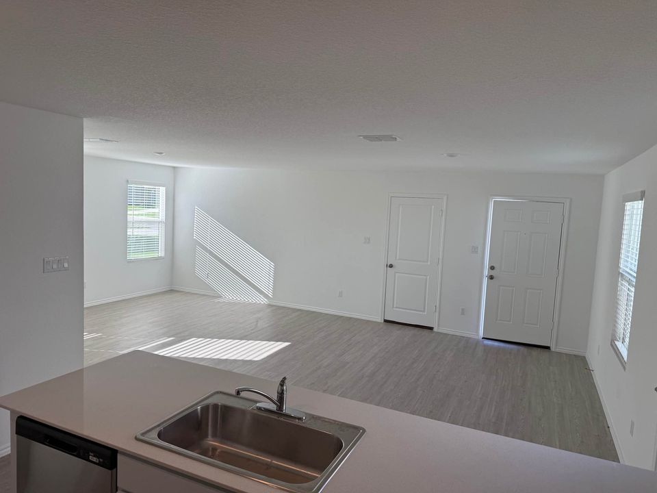 113 Marty Allen Loop Jarrell, TX 76537 - Photo 15 of 16 Open and Airy Floor Plan * Neutral Color Palette * LVP Flooring in Family Room