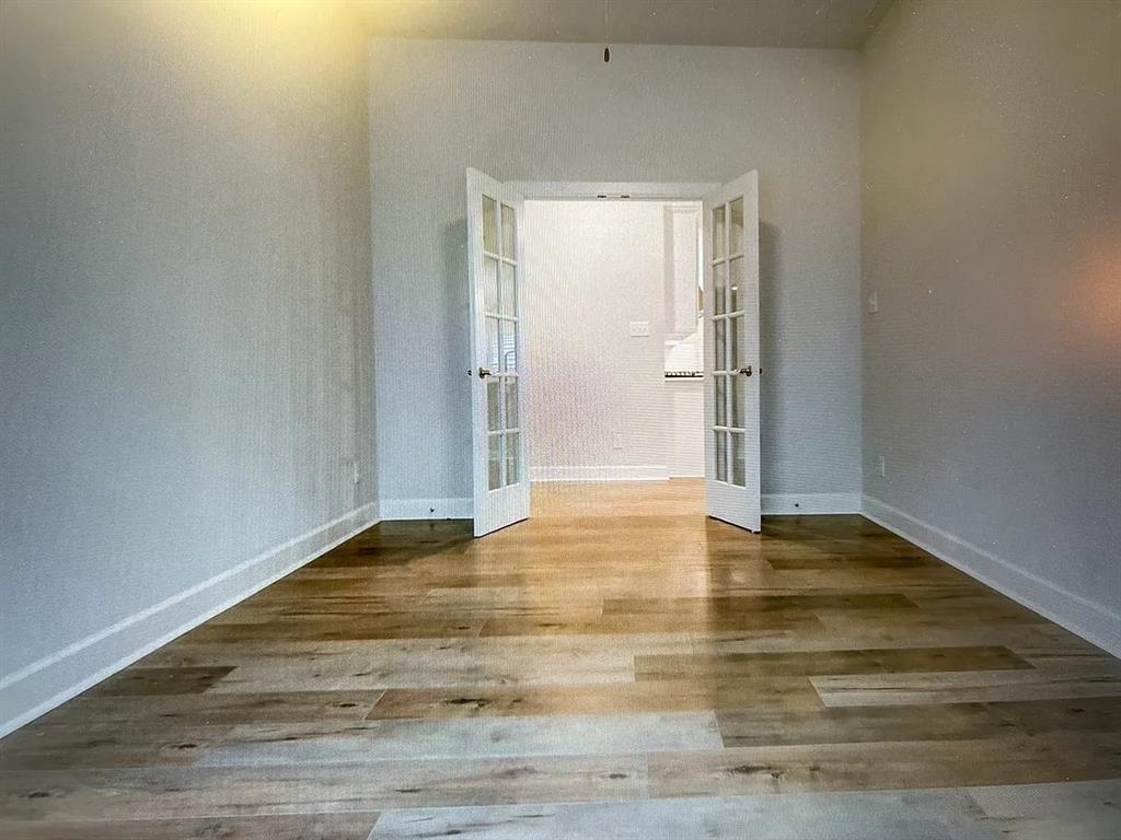 5541 Annie Creek Road Fort Worth, TX 76126 - Photo 5 of 8 a view of an empty room and wooden floor