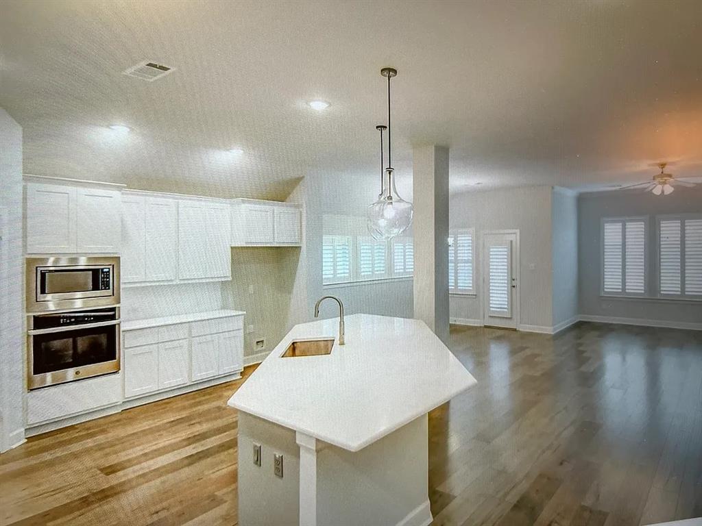 5541 Annie Creek Road Fort Worth, TX 76126 - Photo 7 of 8 a kitchen with granite countertop a stove a sink and a refrigerator