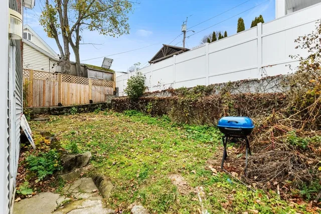 a view of a large white building with large windows