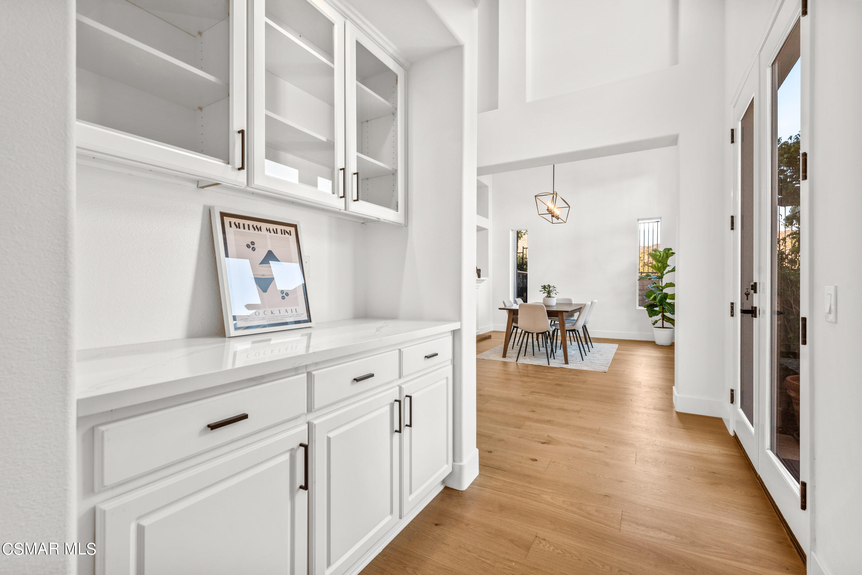 5984 Piuma Court Simi Valley, CA 93063 - Photo 14 of 70 a view of a hallway with white cabinets and wooden floor