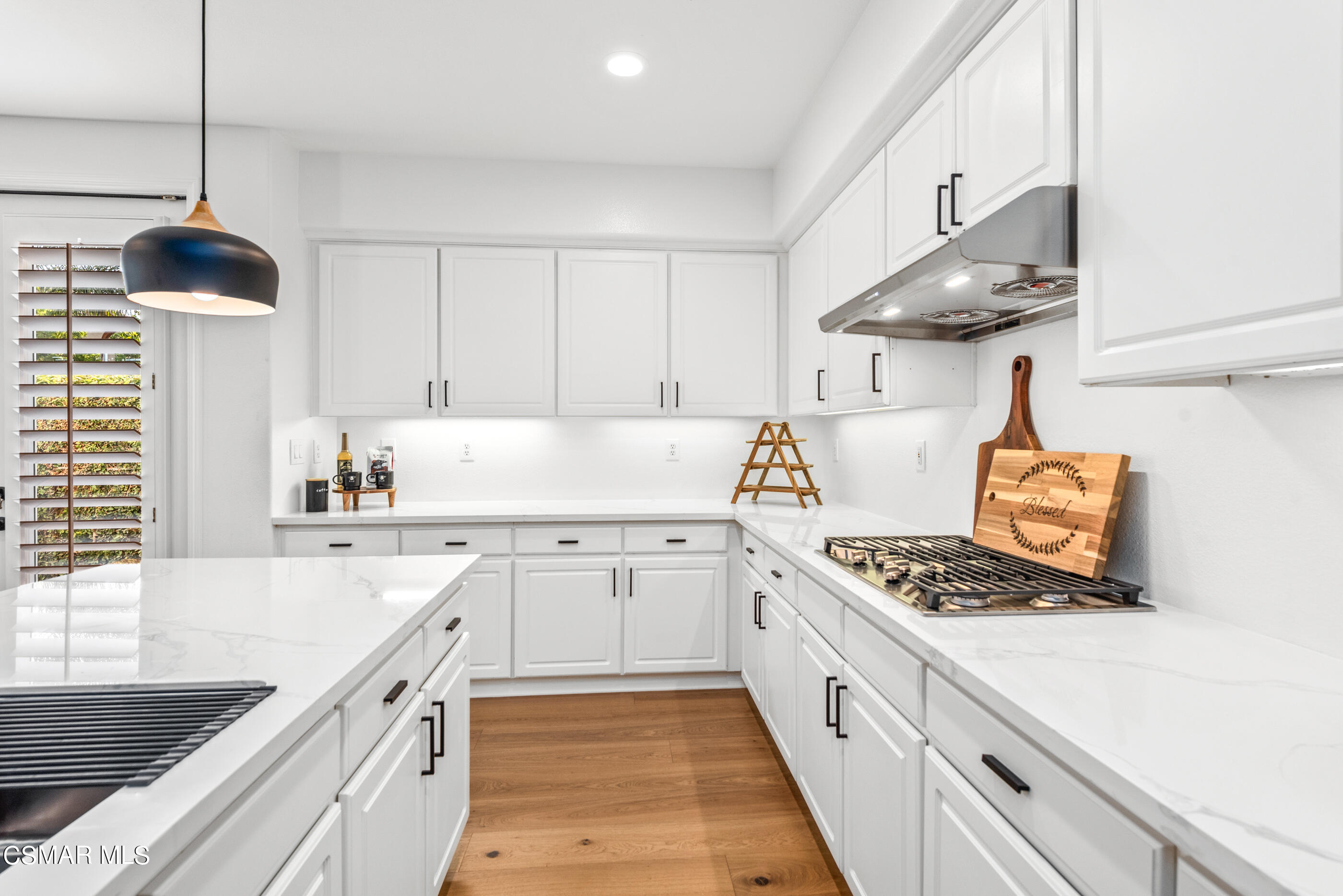 5984 Piuma Court Simi Valley, CA 93063 - Photo 23 of 70 a kitchen with stainless steel appliances granite countertop a sink stove and cabinets