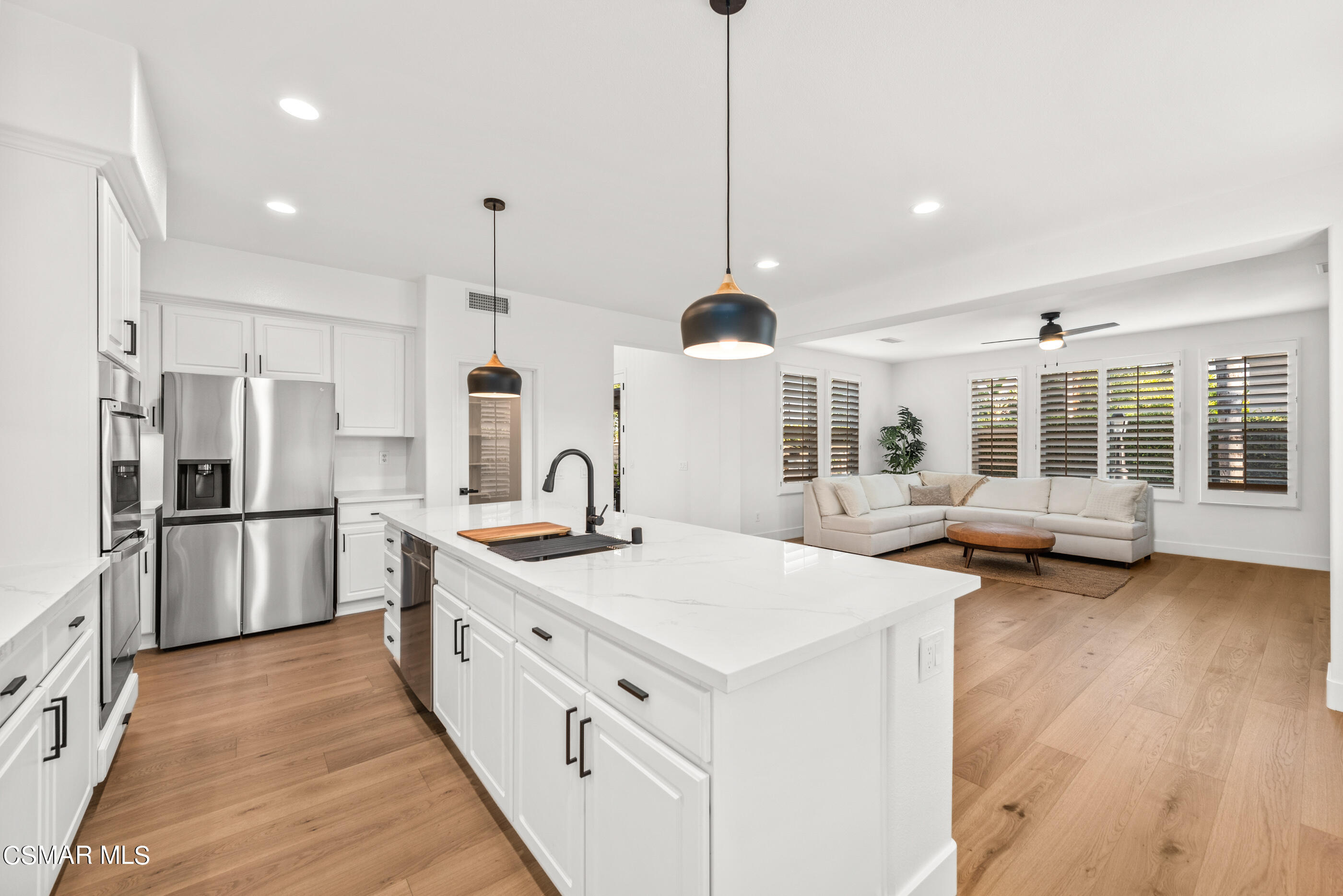 5984 Piuma Court Simi Valley, CA 93063 - Photo 25 of 70 a kitchen with stainless steel appliances granite countertop a sink a stove and a refrigerator