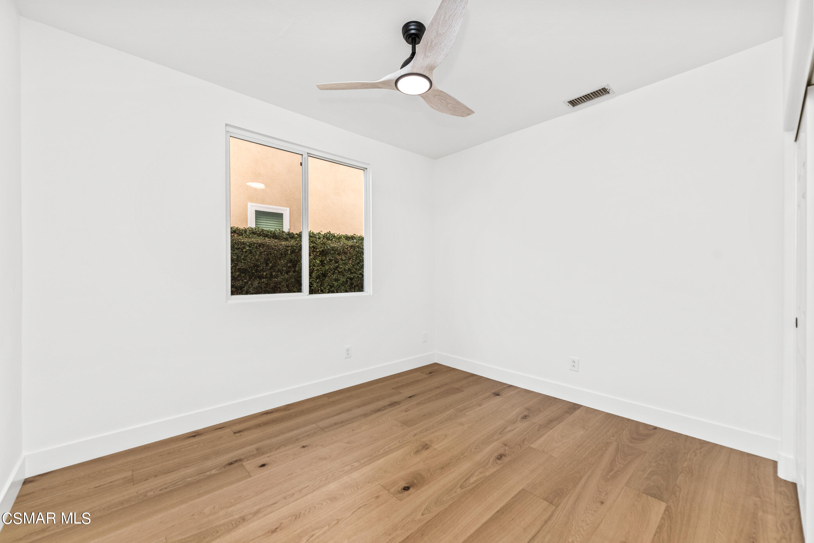 5984 Piuma Court Simi Valley, CA 93063 - Photo 31 of 70 a view of a room with wooden floor and windows