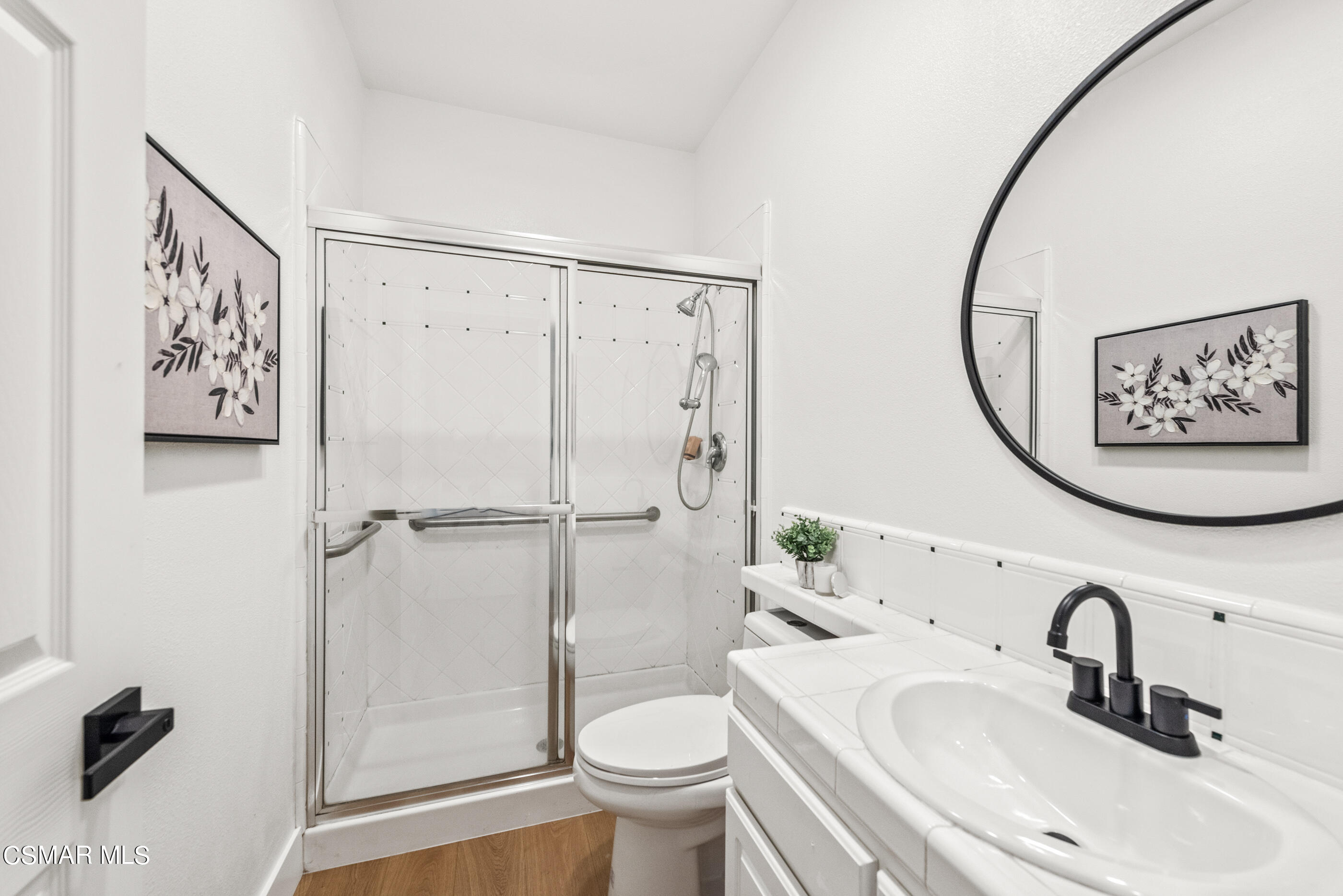 5984 Piuma Court Simi Valley, CA 93063 - Photo 32 of 70 a bathroom with a toilet sink and a mirror