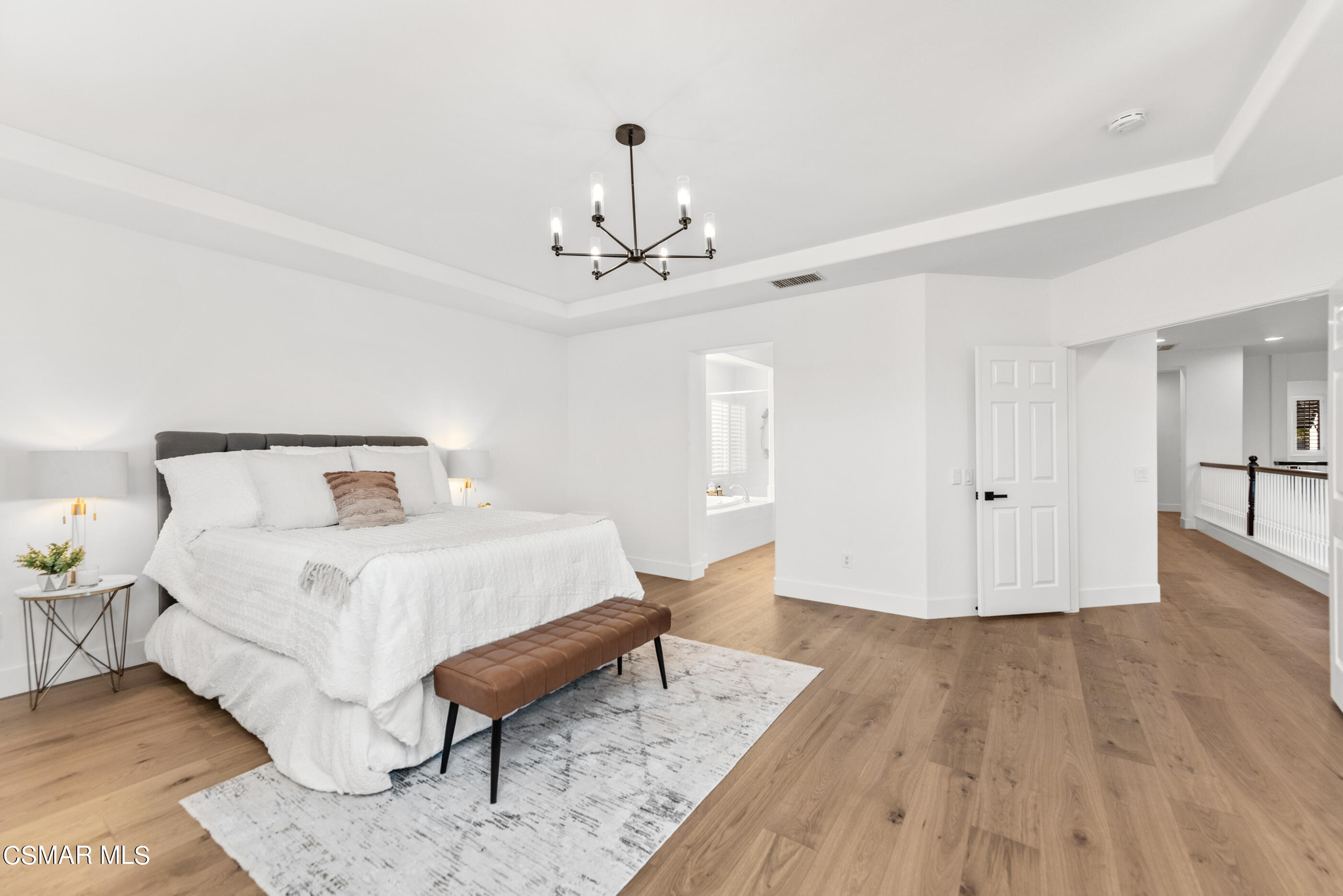5984 Piuma Court Simi Valley, CA 93063 - Photo 36 of 70 a spacious bedroom with a bed and a table