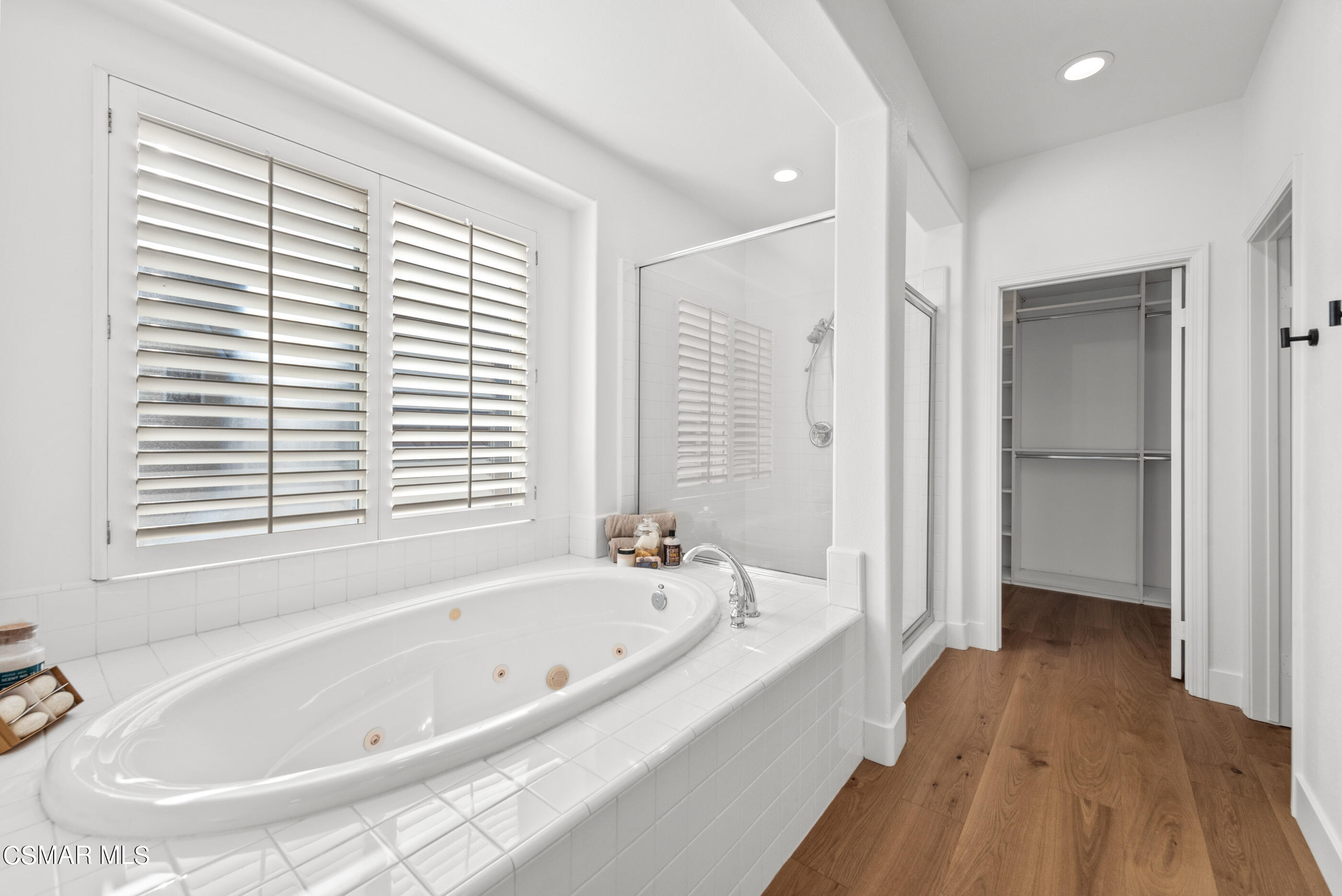 5984 Piuma Court Simi Valley, CA 93063 - Photo 37 of 70 a white bath tub sitting in a bathroom next to a window