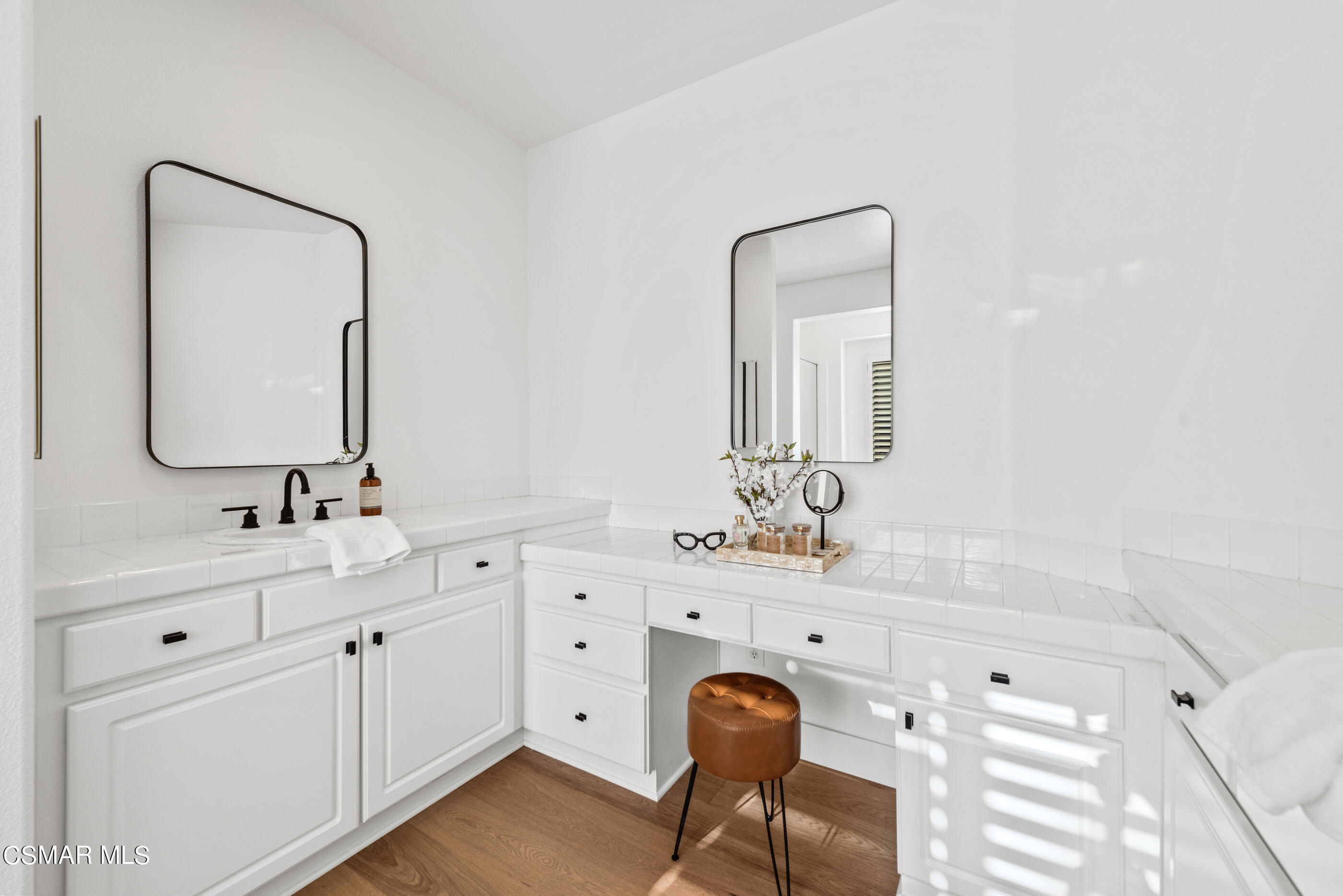 5984 Piuma Court Simi Valley, CA 93063 - Photo 38 of 70 a bathroom with a sink vanity and mirror