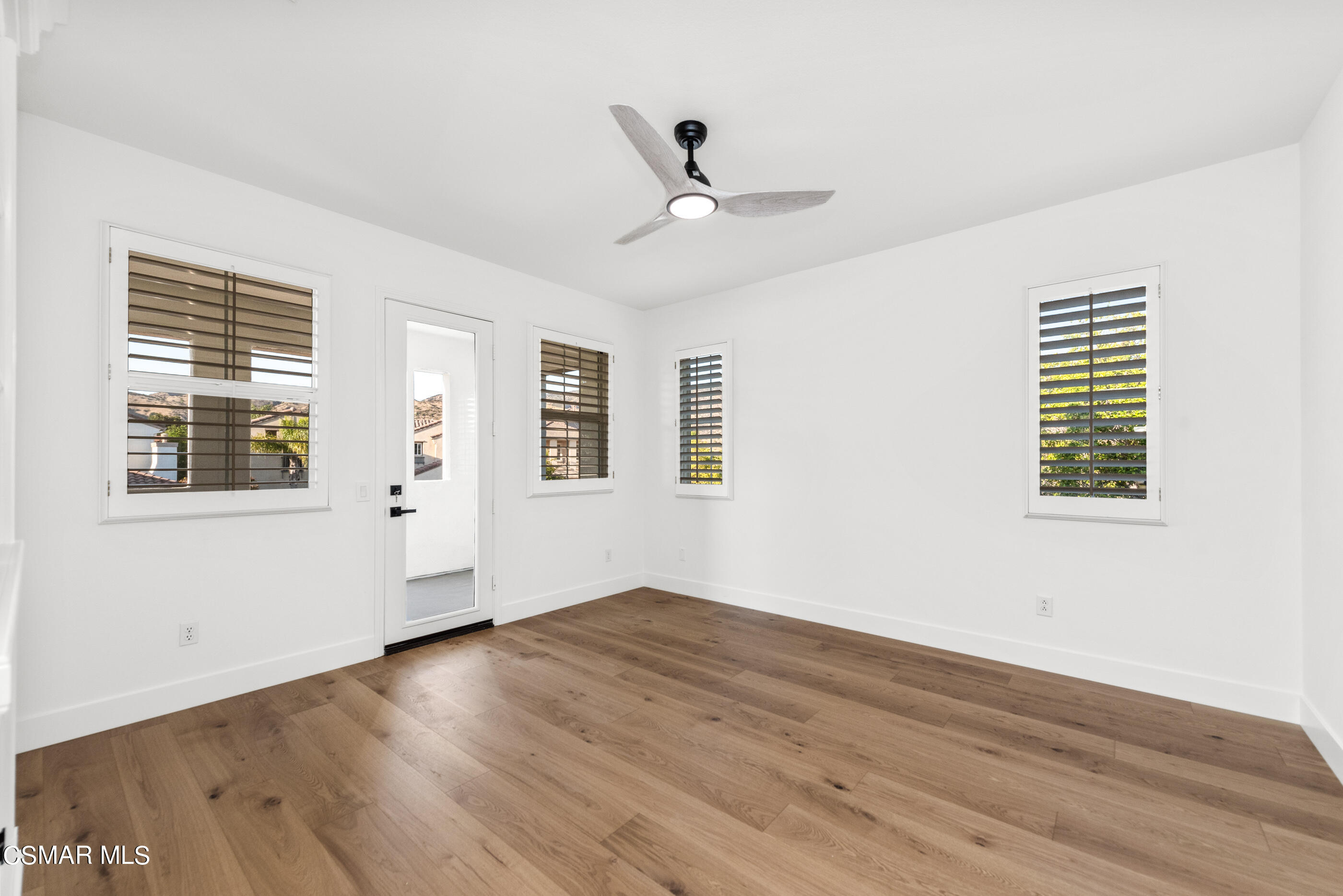 5984 Piuma Court Simi Valley, CA 93063 - Photo 43 of 70 a view of an empty room with wooden floor and a window