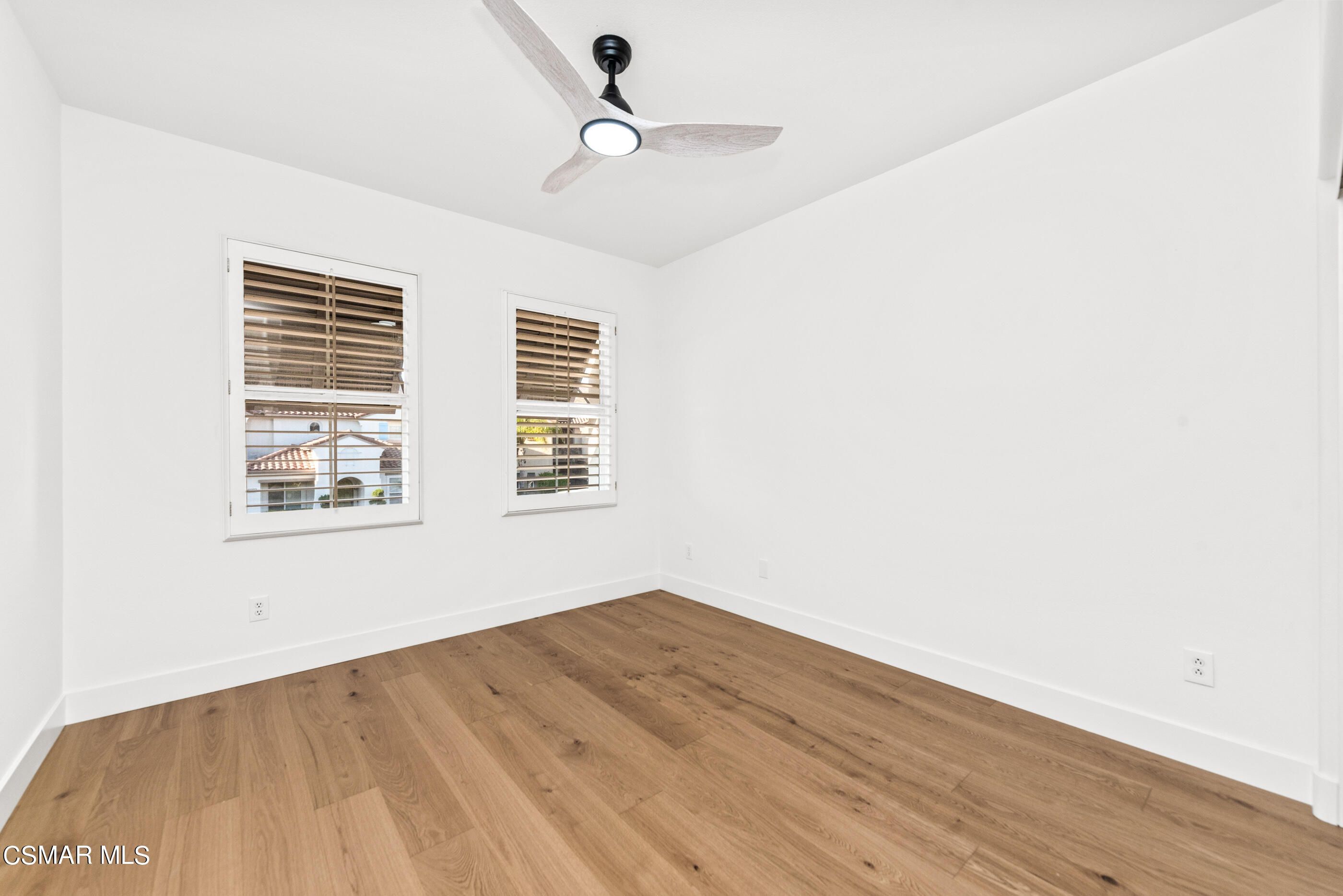 5984 Piuma Court Simi Valley, CA 93063 - Photo 46 of 70 a view of a big room with wooden floor and windows