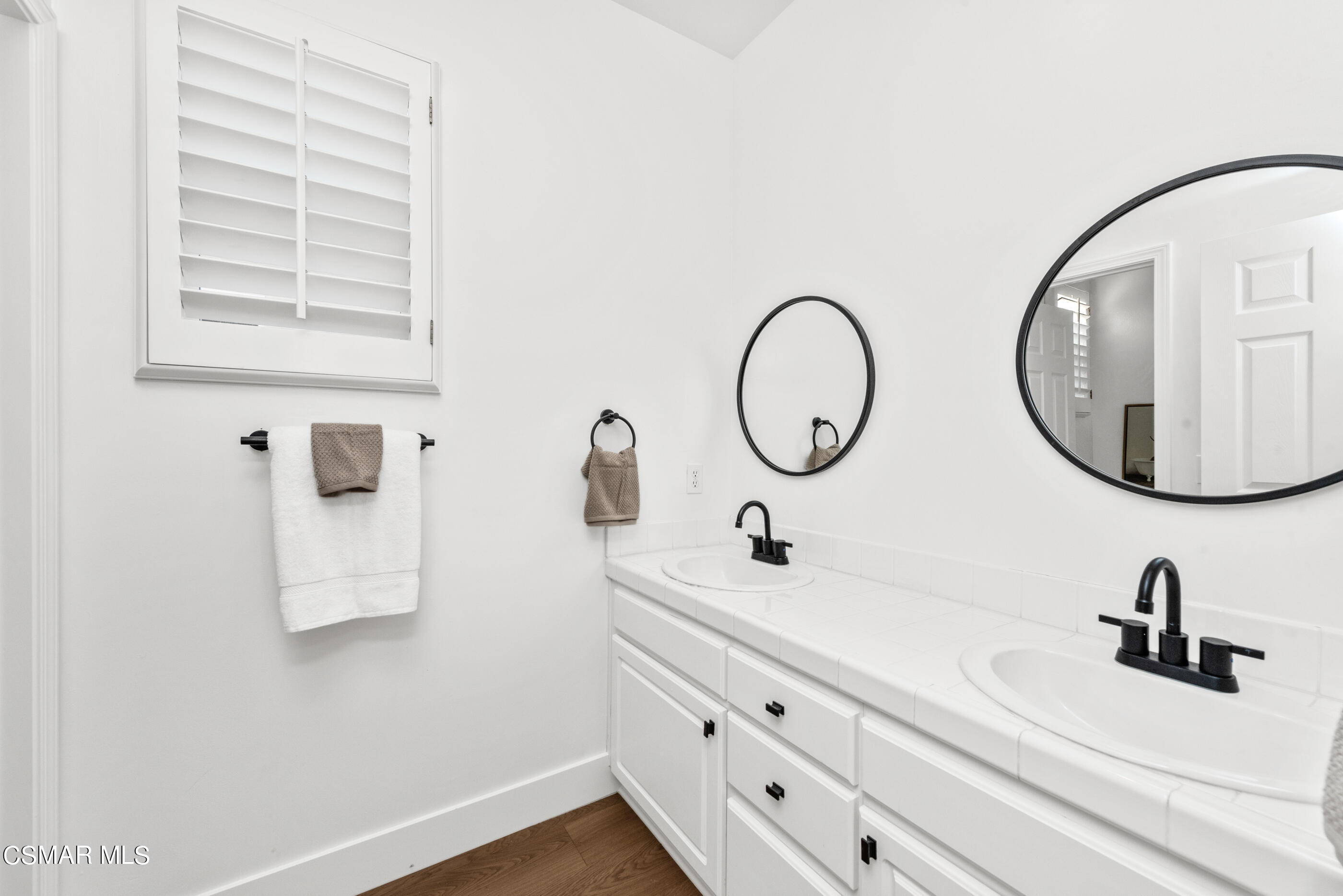 5984 Piuma Court Simi Valley, CA 93063 - Photo 47 of 70 a bathroom with a sink and a mirror