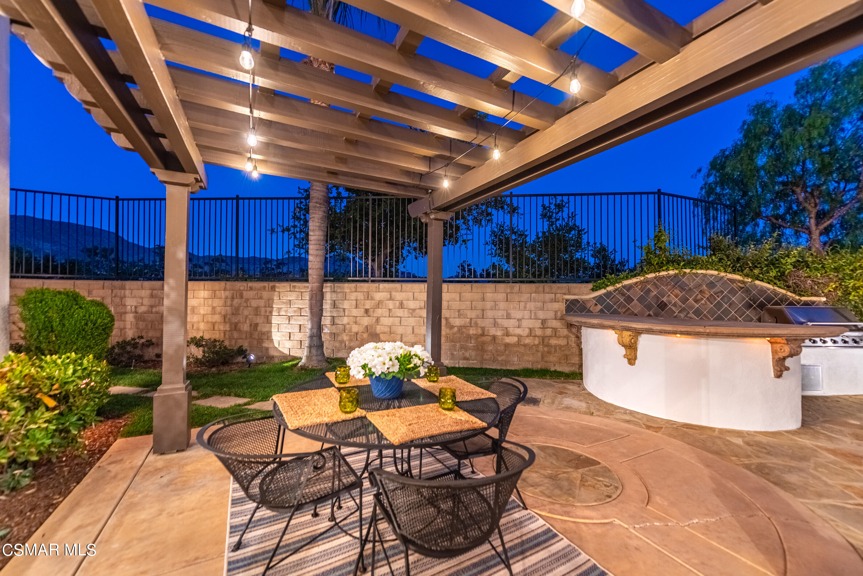 5984 Piuma Court Simi Valley, CA 93063 - Photo 53 of 70 a patio with a table and chairs and potted plants