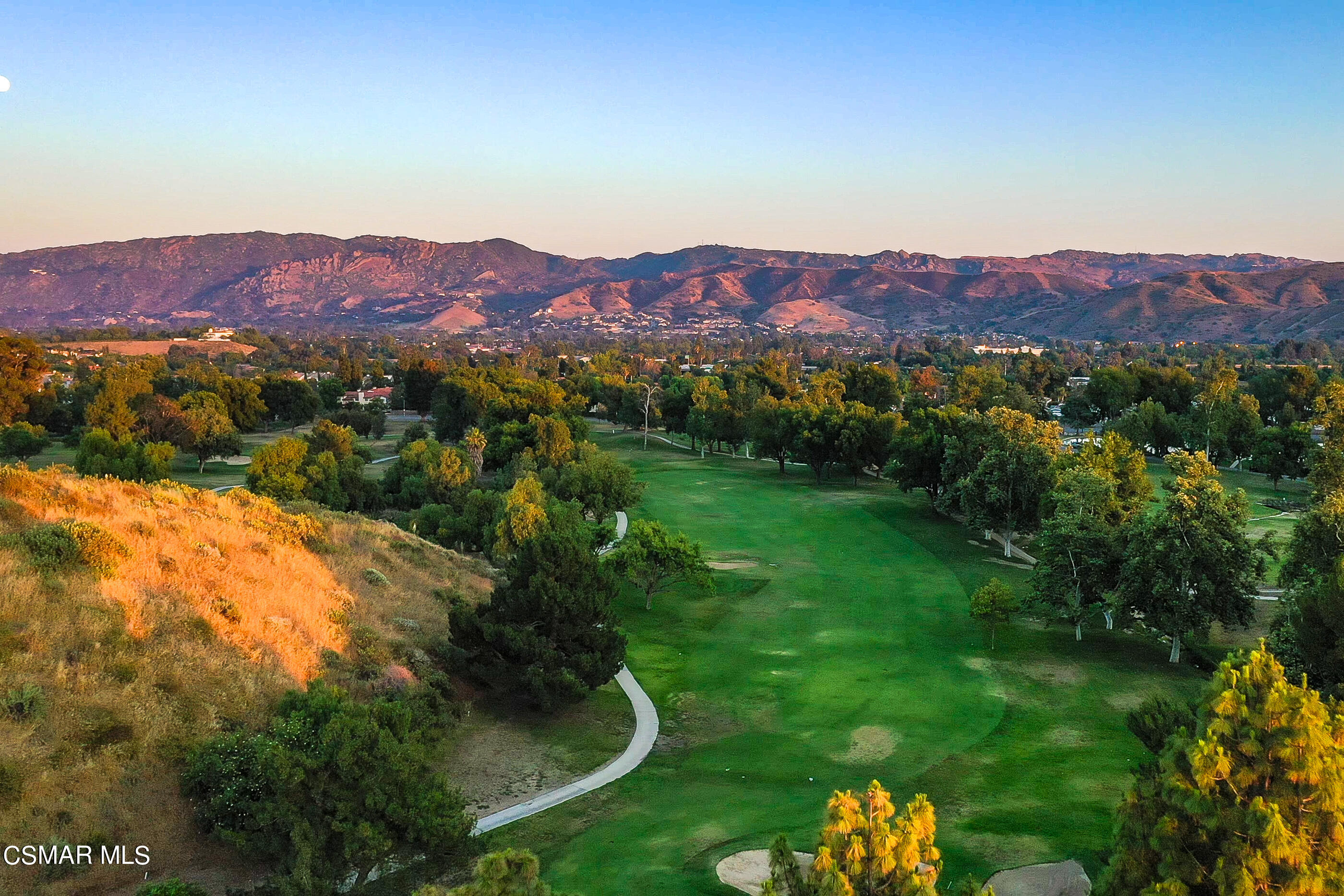 5984 Piuma Court Simi Valley, CA 93063 - Photo 65 of 70 a view of a lush green field with mountains in the background