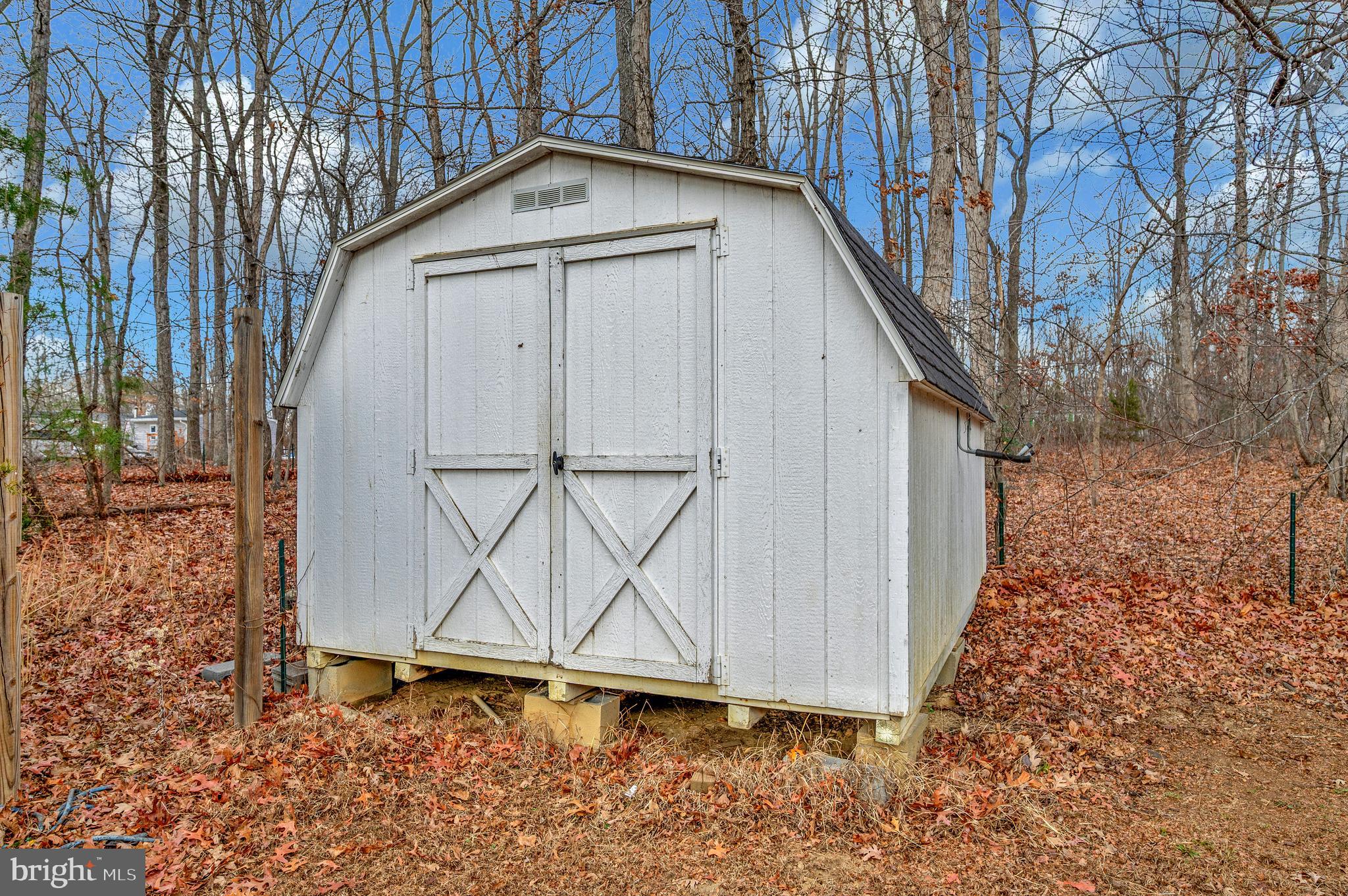 12619 Orange Plank Road Locust Grove, VA 22508 - Photo 11 of 43 a house with trees in front of it