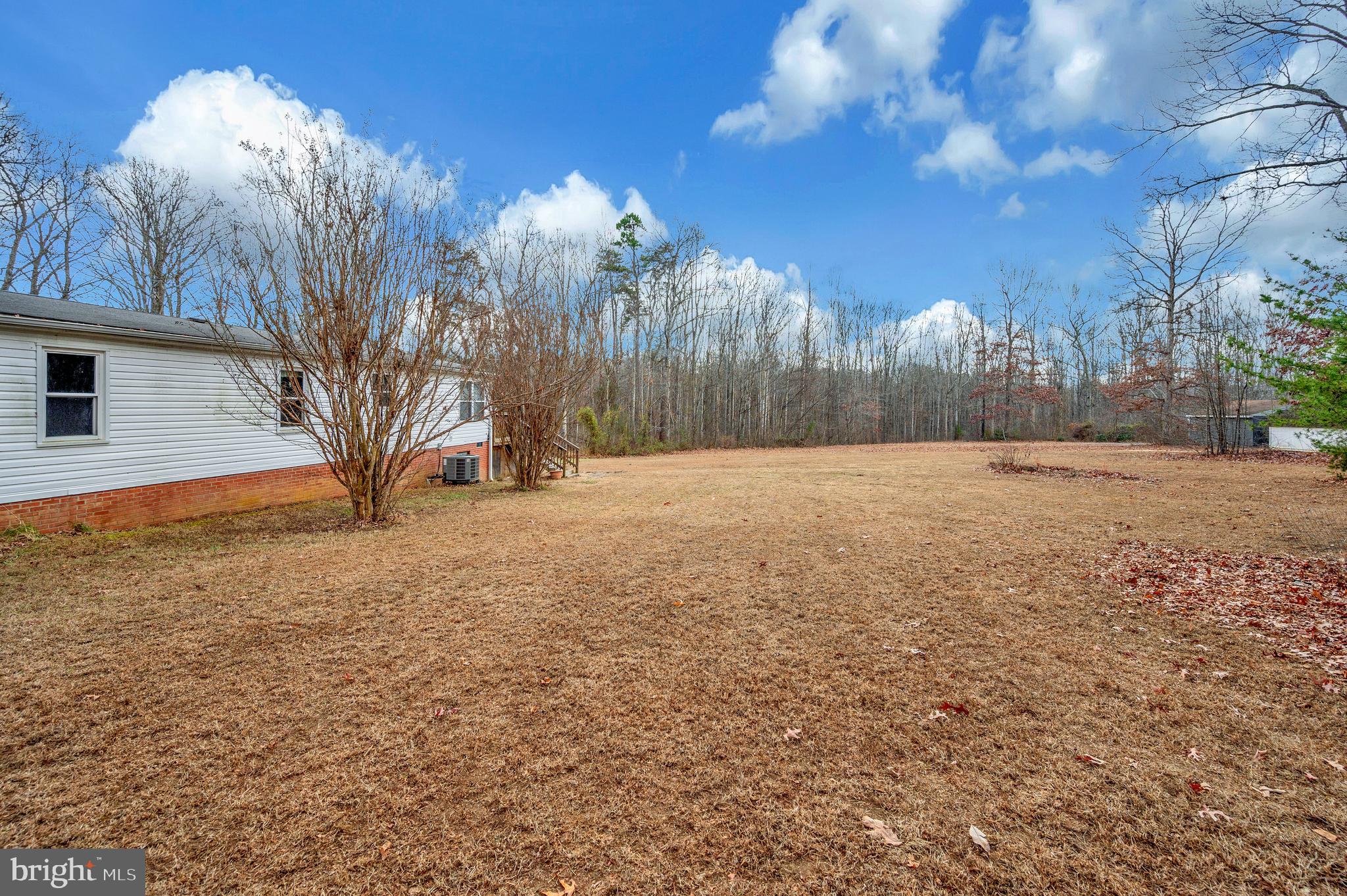 12619 Orange Plank Road Locust Grove, VA 22508 - Photo 13 of 43 a view of patio yard and trees