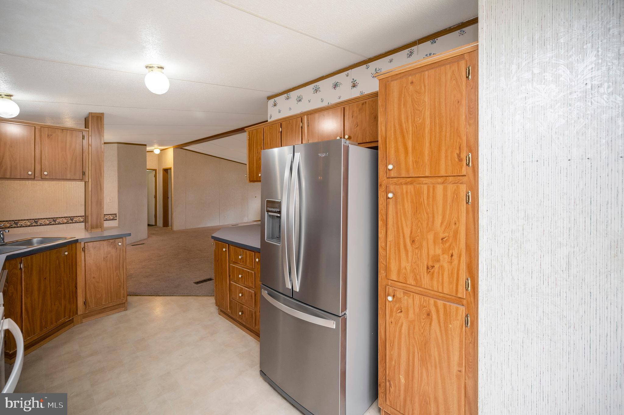 12619 Orange Plank Road Locust Grove, VA 22508 - Photo 19 of 43 a bathroom with a glass shower door and a sink