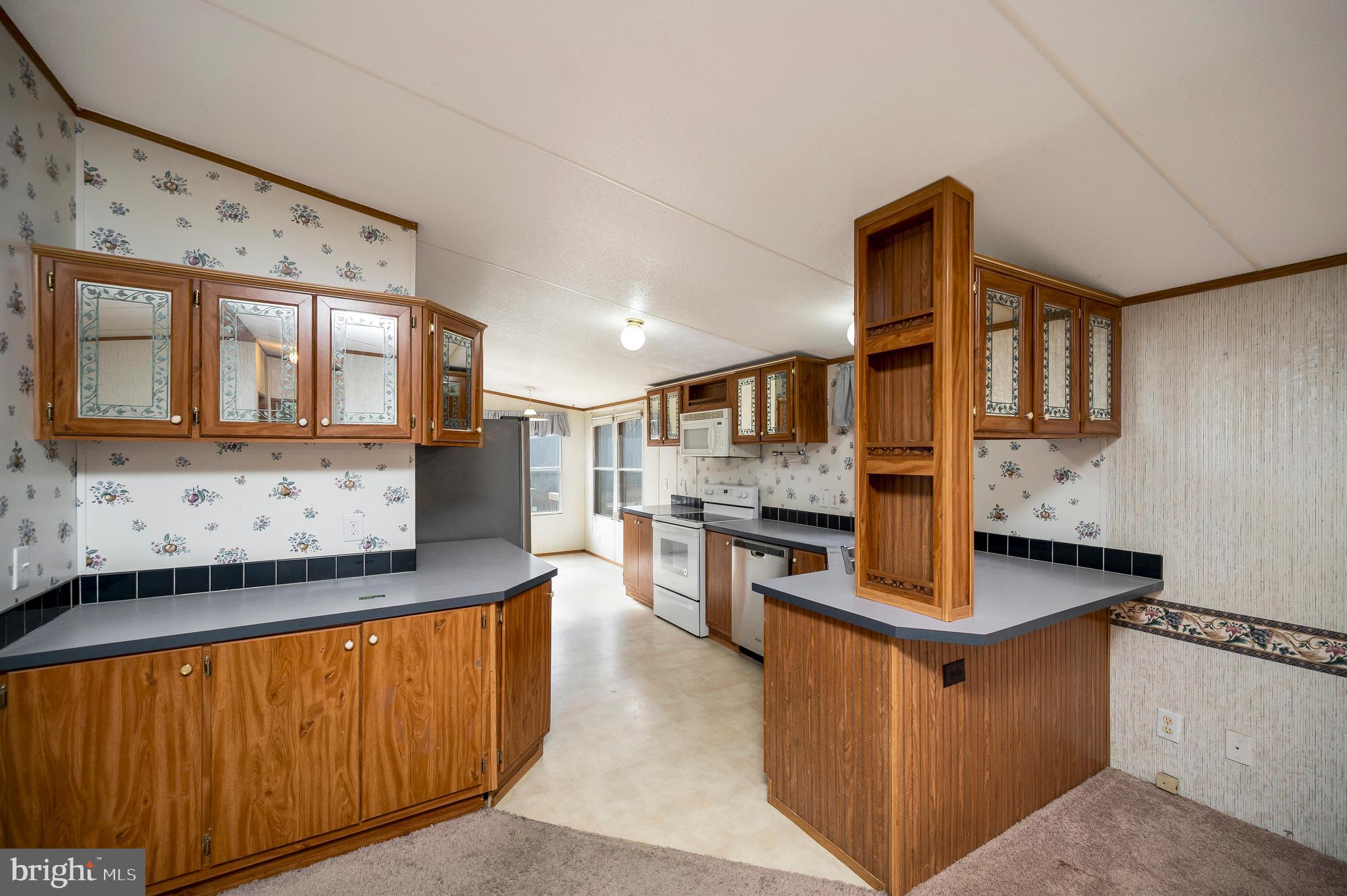 12619 Orange Plank Road Locust Grove, VA 22508 - Photo 21 of 43 a kitchen with stainless steel appliances granite countertop a stove and a sink