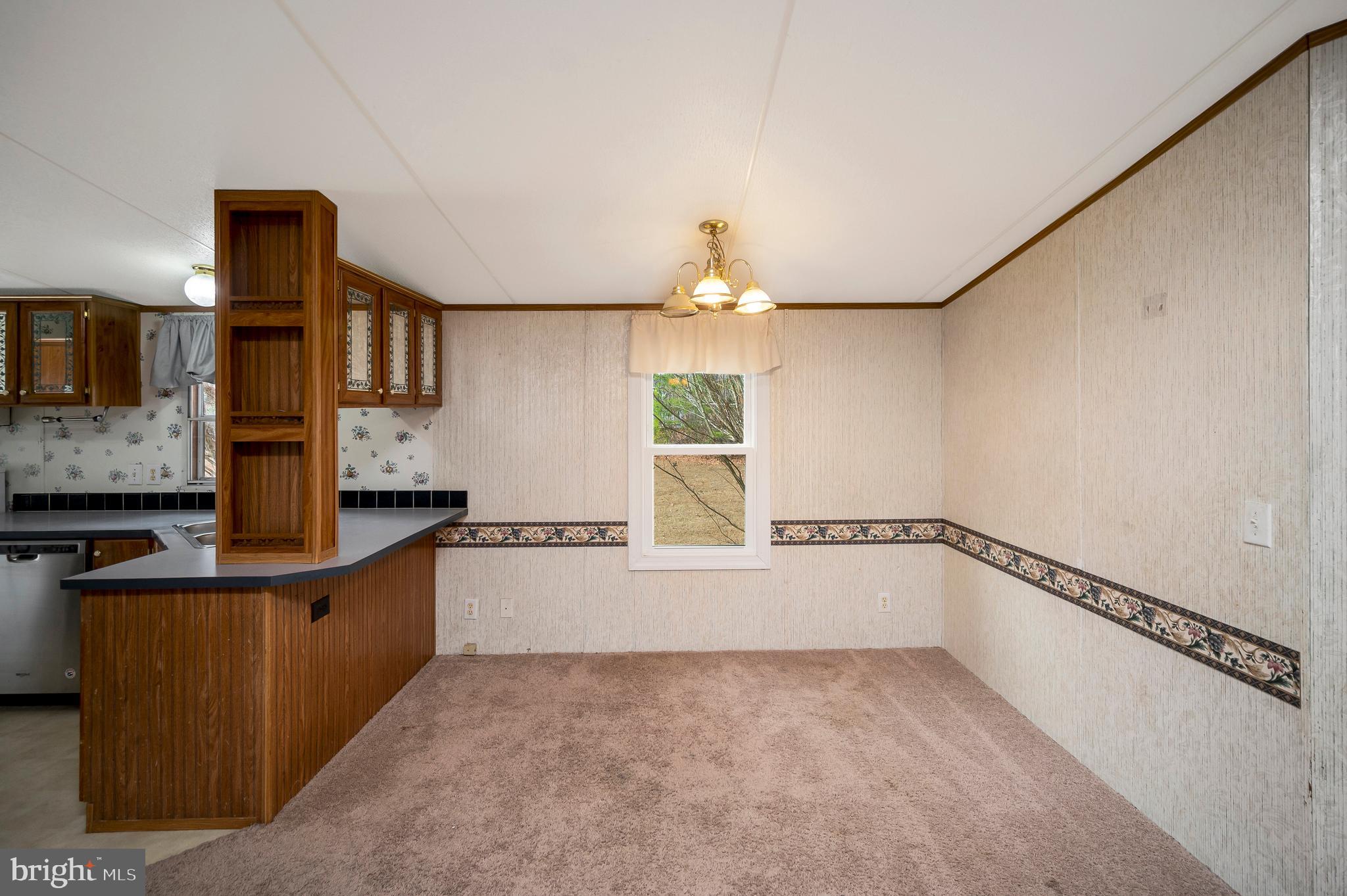 12619 Orange Plank Road Locust Grove, VA 22508 - Photo 25 of 43 a kitchen with a refrigerator and a sink