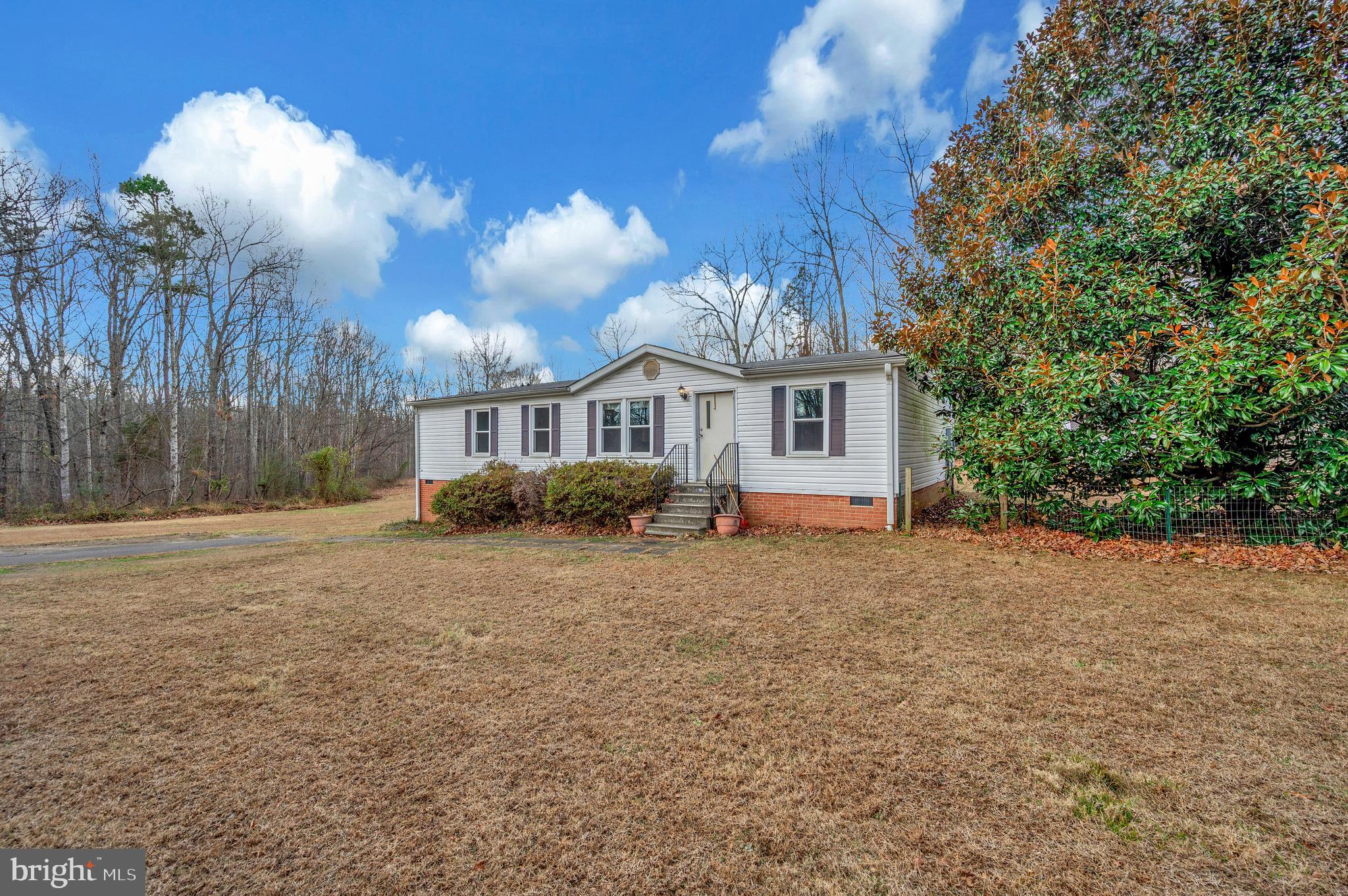 12619 Orange Plank Road Locust Grove, VA 22508 - Photo 3 of 43 a view of a house with backyard and trees