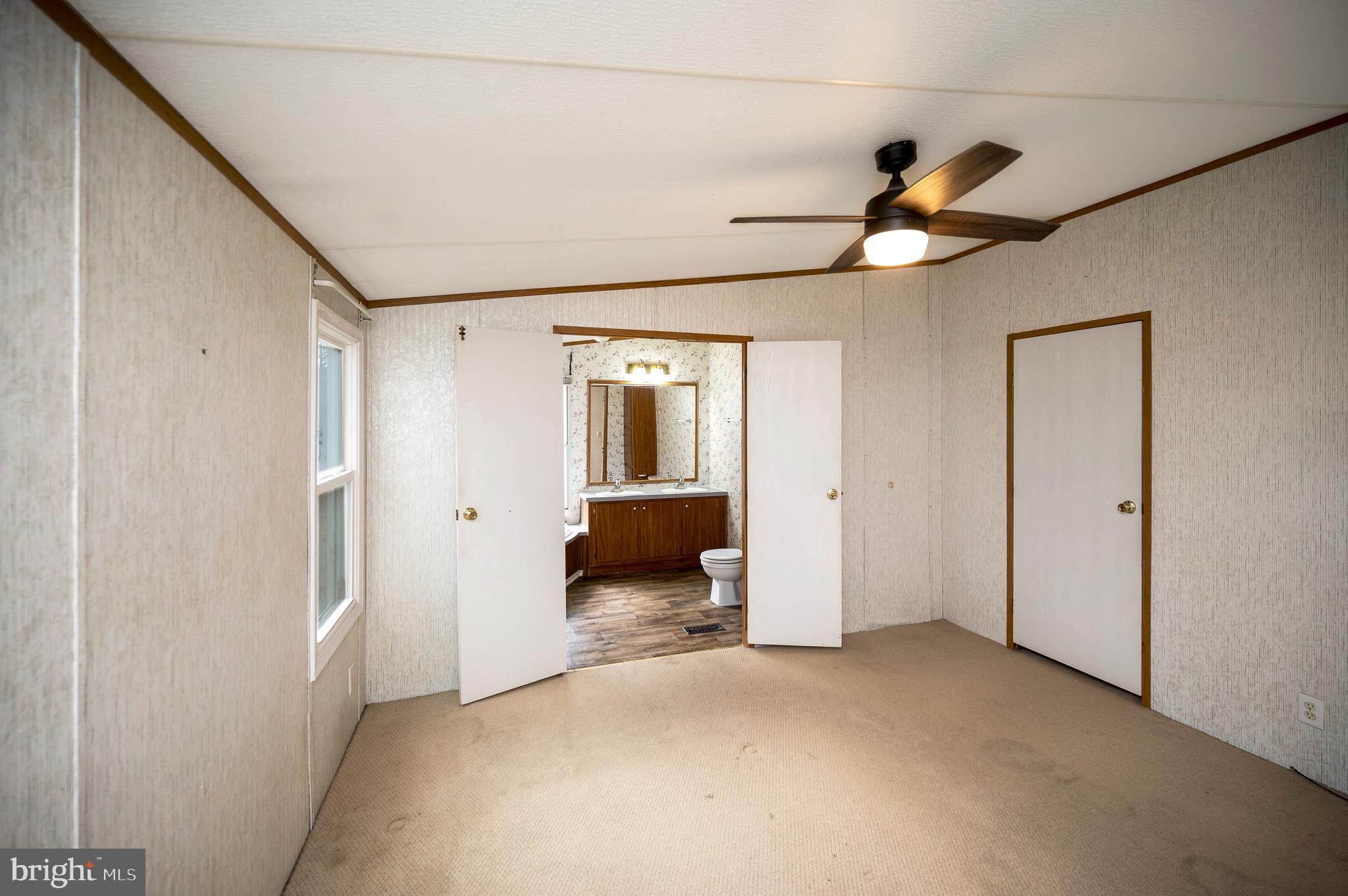 12619 Orange Plank Road Locust Grove, VA 22508 - Photo 34 of 43 a view of a room with wooden floor and windows