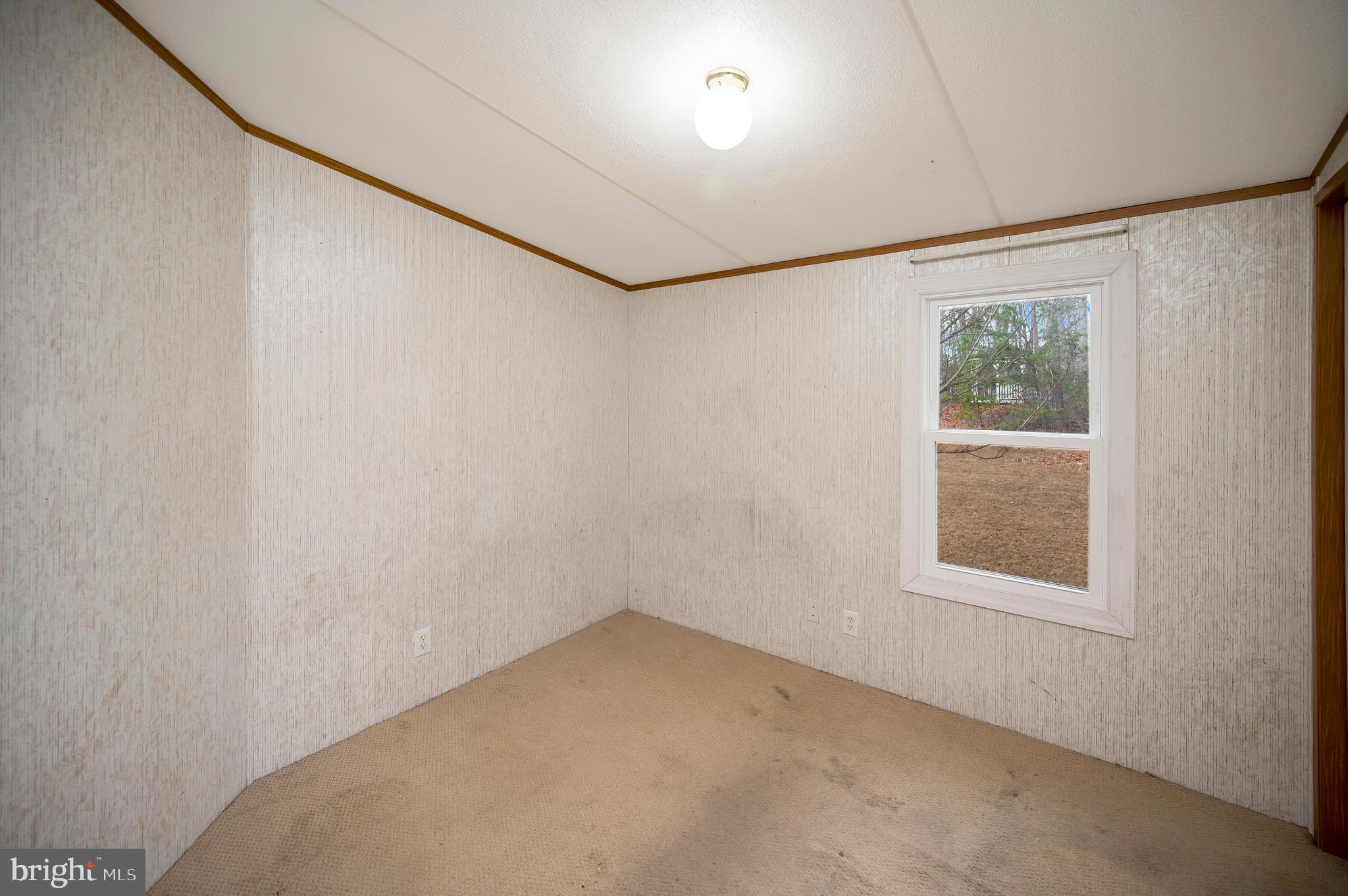 12619 Orange Plank Road Locust Grove, VA 22508 - Photo 40 of 43 an empty room with a window