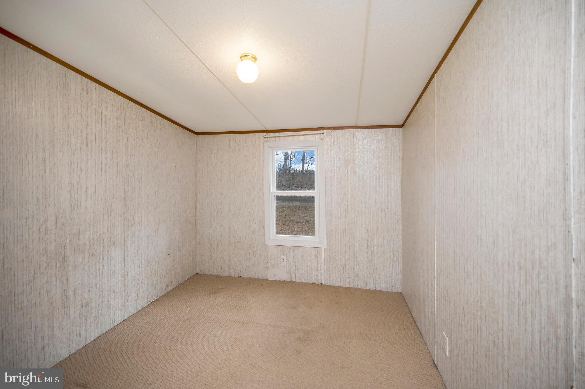 12619 Orange Plank Road Locust Grove, VA 22508 - Photo 42 of 43 a view of an empty room with a window