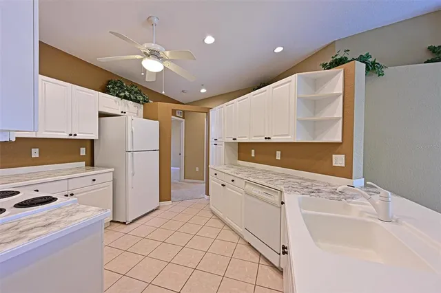 a kitchen with a refrigerator sink and dishwasher
